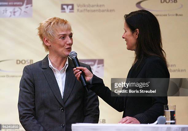 Katrin Mueller-Hohenstein of the ZDF interviews Kirsten Ulrich of Sporttreff Karower Dachse after winning the third place during the �Grossen Stern...