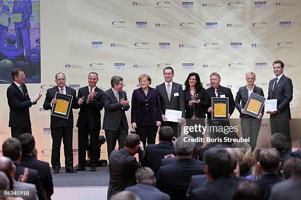 Uwe Froehlich president of the Federal Association of the German Volksbanken and Raiffeisenbanken, second place winner Harald Zeller of TuS 1921...