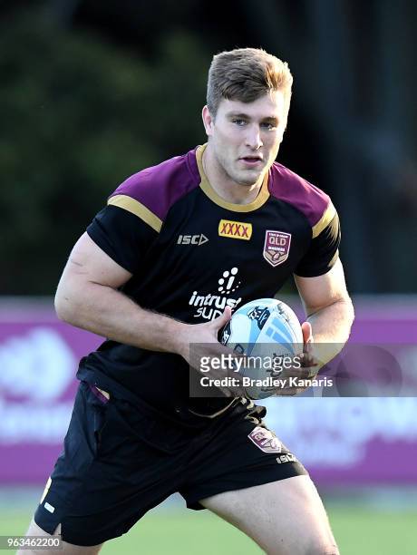 Jai Arrow runs with the ball during a Queensland Maroons State of Origin training session on May 29, 2018 in Brisbane, Australia.