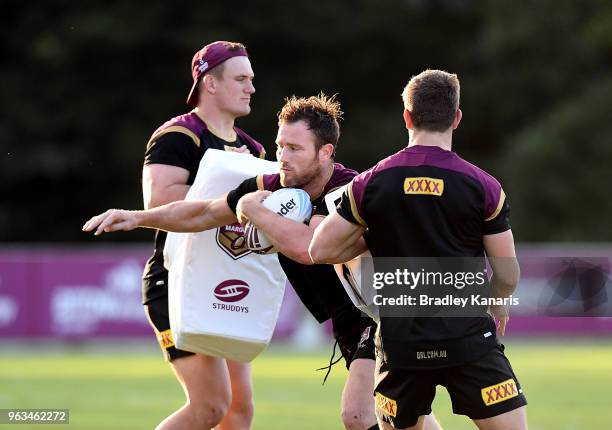 Gavin Cooper takes on the defence during a Queensland Maroons State of Origin training session on May 29, 2018 in Brisbane, Australia.