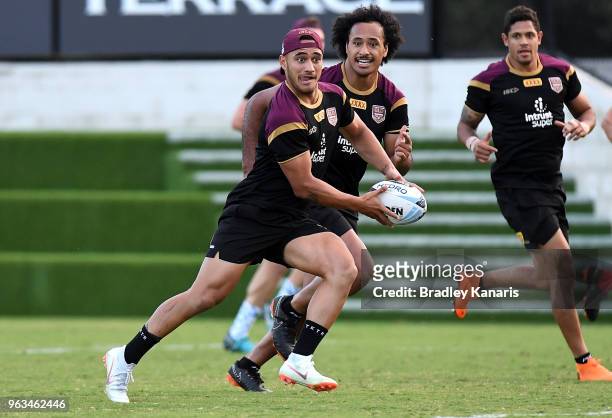 Valentine Holmes runs with the ball during a Queensland Maroons State of Origin training session on May 29, 2018 in Brisbane, Australia.