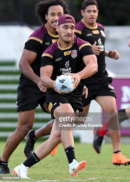 Valentine Holmes runs with the ball during a Queensland Maroons State of Origin training session on May 29, 2018 in Brisbane, Australia.