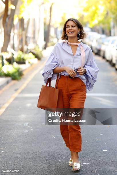 Nathalie Kelley wearing Thierry Coulson blouse, All That Remains pants, MNZ sandals and Ellery seashell earrings on May 29, 2018 in Sydney, Australia.