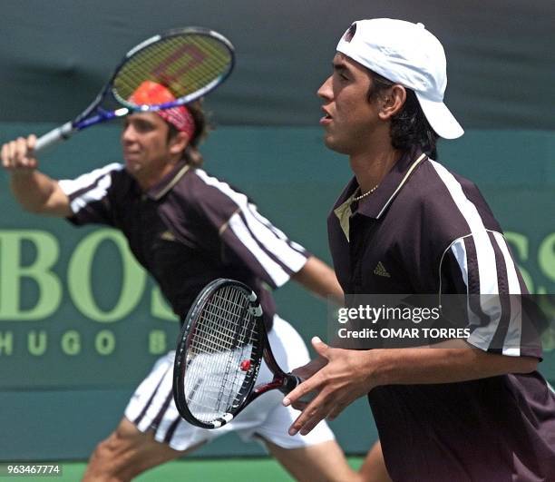 Venezuelans Jimy Szymanski and Jose de Armas in action during a doubles match in the Davis Cup, 22 July 2000. The pair lost to Mexico. AFP PHOTO/Omar...