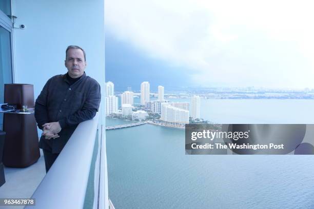 Rendon, a right-wing political consultant with clients across Latin America, is pictured on the balcony of his penthouse apartment in Miami. Rendon...