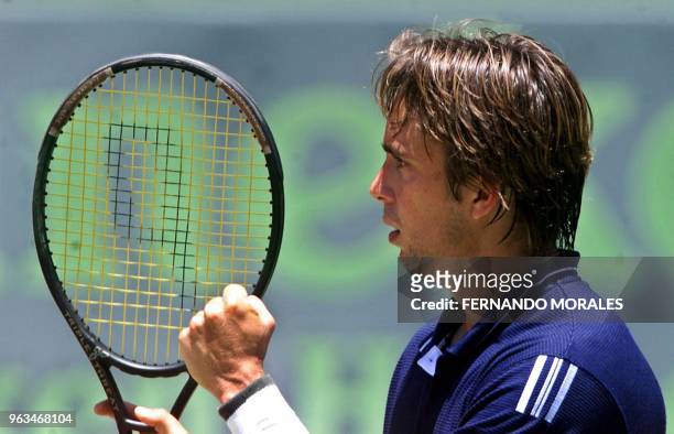 Venezuelan tennis player Jimy Szymanski celebrates his victory in the match in Guatemala City 06 April 2001 for the Davis Cup. Szymanski won 6-3,...