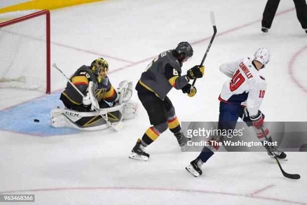 Washington Capitals right wing Brett Connolly takes a shot on goal that goes around Vegas Golden Knights defenseman Colin Miller and goaltender...