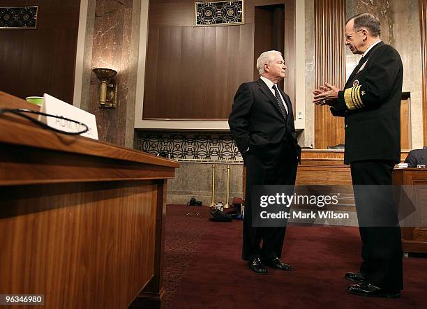 Defense Secretary Robert Gates and Chairman of the Joint Chiefs of Staff Adm. Michael Mullen talk before the start of a Senate Armed Services...