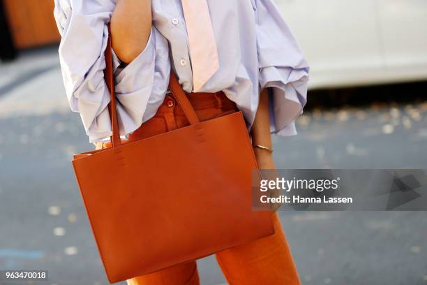 Nathalie Kelley wearing Thierry Coulson blouse, All That Remains pants, MNZ sandals, Cuero & Mor bag and Ellery seashell earrings on May 29, 2018 in...