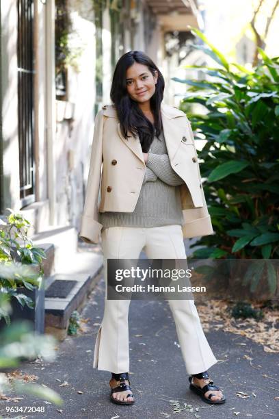 Alex Teo wearing Khaite pants and jacket, Shaina Mote sweater and Isabel Marant sandals on May 29, 2018 in Sydney, Australia.