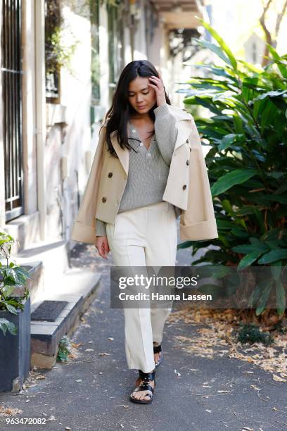 Alex Teo wearing Khaite pants and jacket, Shaina Mote sweater and Isabel Marant sandals on May 29, 2018 in Sydney, Australia.