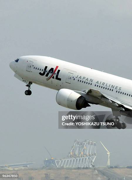 In a picture taken on January 29, 2010 a jetliner from Asia's largest air carrier Japan Airlines takes off from Tokyo's Haneda airport. A Japanese...