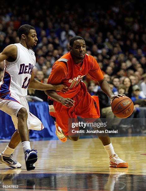 Scoop Jardine of the Syracuse Orange drives against Jeremiah Kelly of the DePaul Blue Demons at the Allstate Arena on January 30, 2010 in Rosemont,...