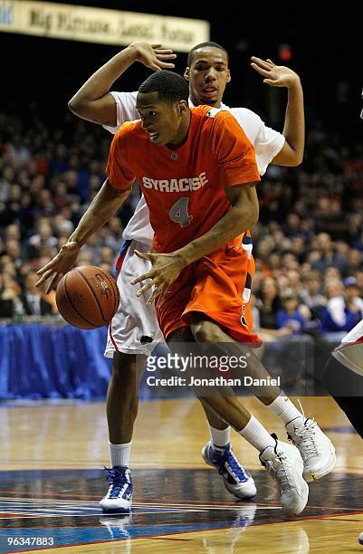 Wes Johnson of the Syracuse Orange drives around Mike Stovall of the DePaul Blue Demons at the Allstate Arena on January 30, 2010 in Rosemont,...