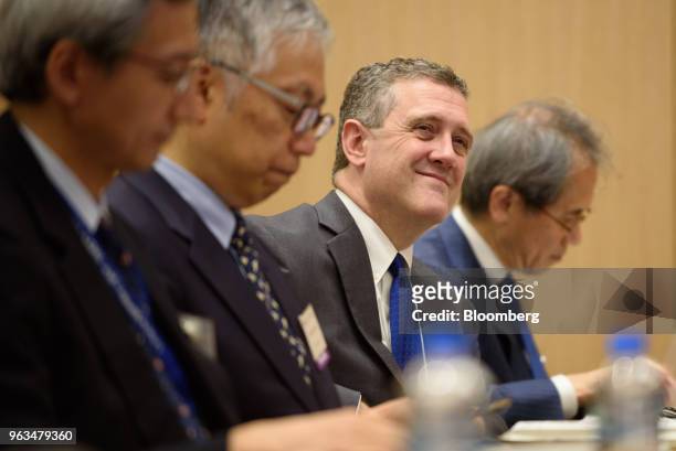 James Bullard, president and chief executive officer of the Federal Reserve Bank of St. Louis, second right, attends an event in Tokyo, Japan, on...