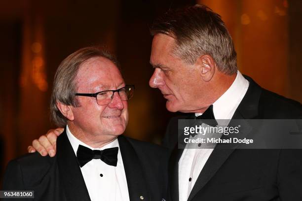 Legendary Essendon Bombers coach and Richmond Tigers footballer Kevin Sheedy talks with former Collingwood footballer Peter Moore during the...