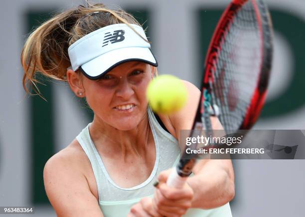 France's Fiona Ferro plays a return Germany's Carina Witthoeft during their women's singles first round match, on day three of The Roland Garros 2018...