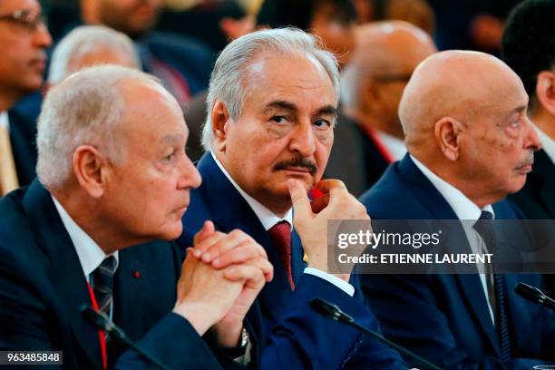 Libyan National Army's Field Marshal Khalifa Haftar flanked by Libya's parliament speaker based in the eastern town of Tobruk Aguila Saleh Issa ,...