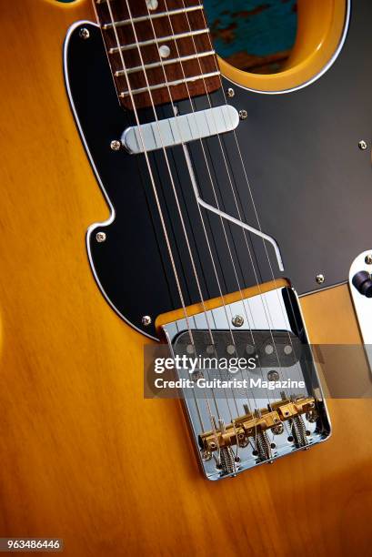 Detail of the Wilkinson WTB bridge on a Fret King Country Squire Fluence electric guitar with a Butterscotch finish, taken on March 7, 2017.