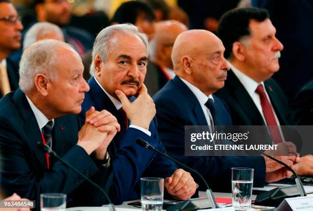 Libyan National Army's Field Marshal Khalifa Haftar flanked by Libya's parliament speaker based in the eastern town of Tobruk Aguila Saleh Issa ,...