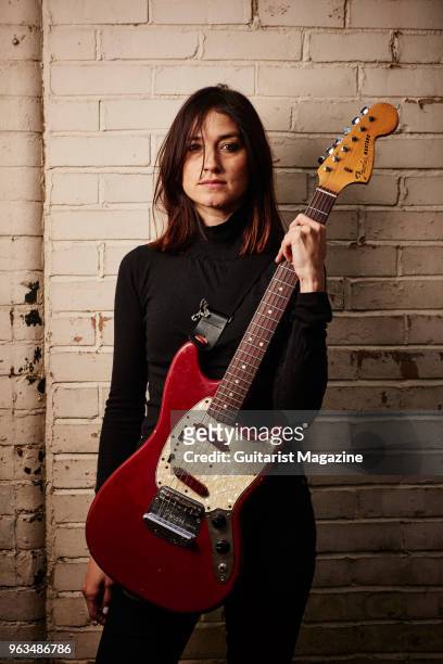 Portrait of American musician Theresa Wayman, guitarist and vocalist with indie rock group Warpaint, photographed before a live performance at the O2...