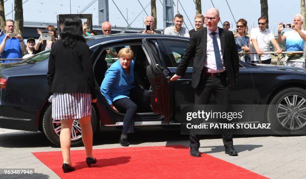 German Chancellor Angela Merkel arrives for a ceremony marking the 25th anniversary of an arson attack that killed five people of Turkish origin, on...