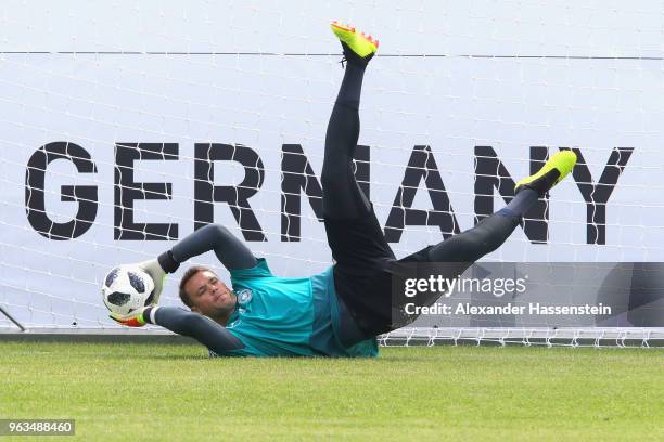 Manuel Neuer safes the ball during a training session of the German national team at Sportanlage Rungg on day seven of the Southern Tyrol Training...