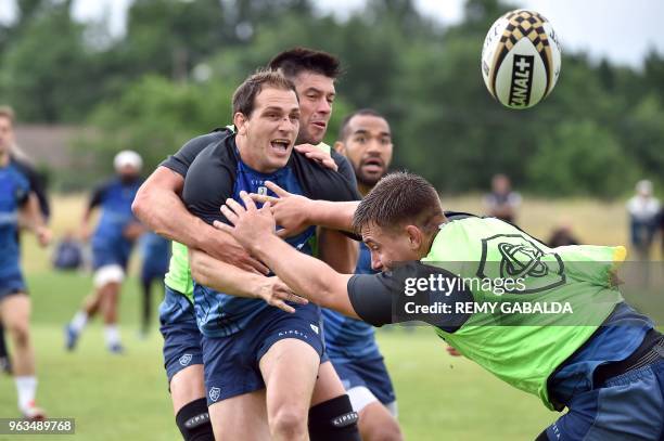 Castres' fly half Benjamin Udrapilleta passes the ball during a training at Levezou stadium in Saix, near Castres, southern France, on May 29 ahead...