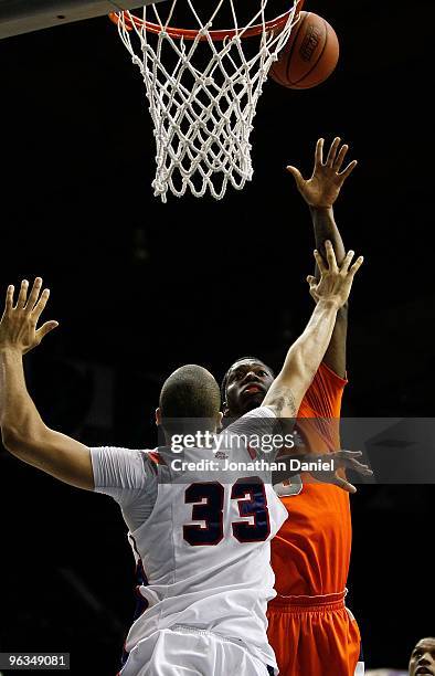 Rick Jackson of the Syracuse Orange puts up a shot over Kris Faber of the DePaul Blue Demons at the Allstate Arena on January 30, 2010 in Rosemont,...