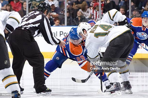 Sam Gagner of the Edmonton Oilers faces off against Jamie Benn of the Dallas Stars at Rexall Place on January 22, 2010 in Edmonton, Alberta, Canada....