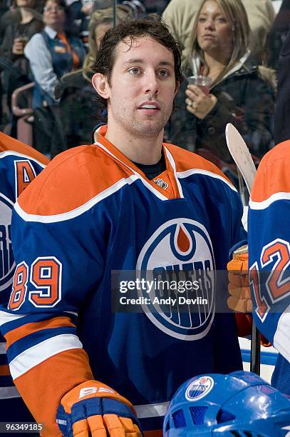 Sam Gagner of the Edmonton Oilers stands for the National Anthems before a game against the Dallas Stars at Rexall Place on January 22, 2010 in...