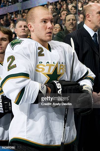 Nicklas Grossman of the Dallas Stars stands for the National Anthems before a game against the Edmonton Oilers at Rexall Place on January 22, 2010 in...