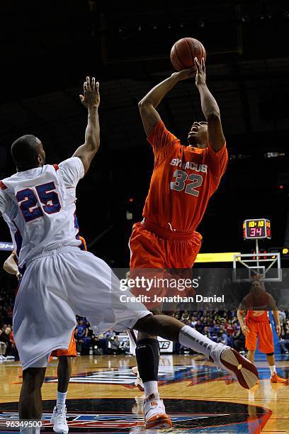 Kris Joseph of the Syracuse Orange puts up a shot over Eric Wallace of the DePaul Blue Demons at the Allstate Arena on January 30, 2010 in Rosemont,...