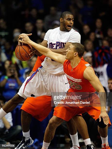 Brandon Triche of the Syracuse Orange knocks the ball away from Eric Wallace of the DePaul Blue Demons at the Allstate Arena on January 30, 2010 in...