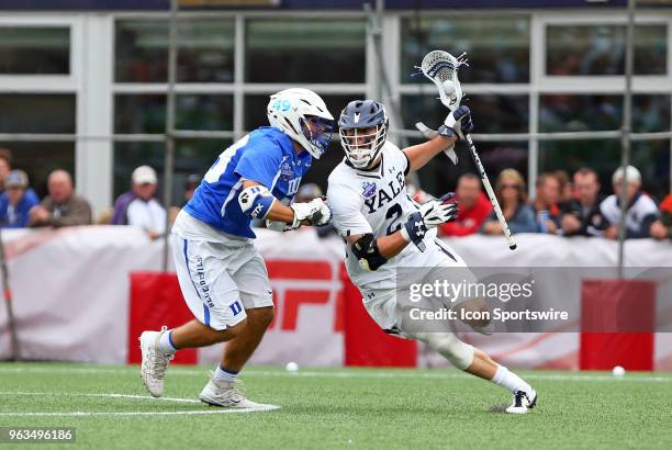 Duke Blue Devils defender Kevin McDonough defends Yale Bulldogs attackman Ben Reeves during the NCAA Division I Men's Championship match between Duke...