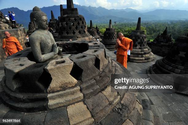 Buddhist monks conduct prayers at Borobudur temple during Vesak day in Magelang on May 29, 2018. - Buddhist devotees in Indonesia celebrated Vesak...
