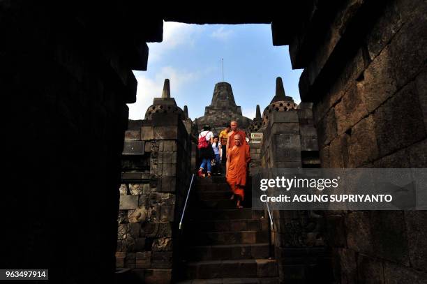 Buddhist monks and devotees conduct prayers at Borobudur temple during Vesak day in Magelang on May 29, 2018. - Buddhist devotees in Indonesia...