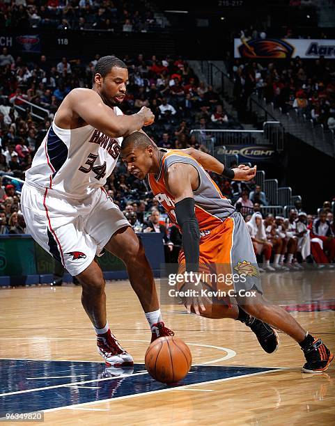 Leandro Barbosa of the Phoenix Suns against Jason Collins of the Atlanta Hawks at Philips Arena on January 15, 2010 in Atlanta, Georgia. NOTE TO...