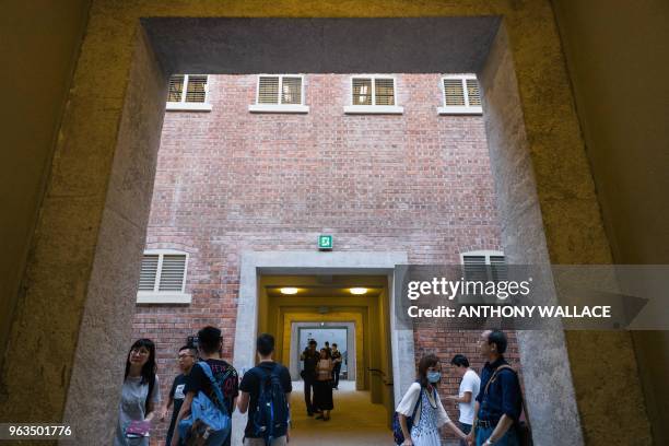 People visit Victoria Prison, a former colonial prison and police station colloquially known as Tai Kwun, or "big station", on its opening day to the...