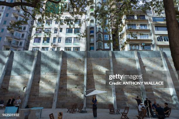 People visit Victoria Prison, a former colonial prison and police station colloquially known as Tai Kwun, or "big station", on its opening day to the...