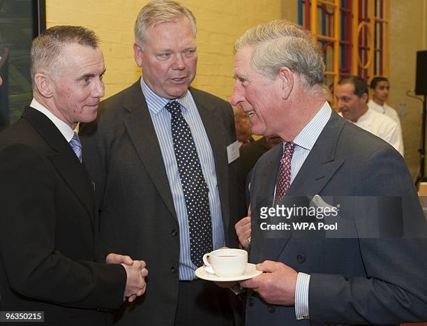 Prince Charles, Prince of Wales speaks to chef Gary Rhodes attends the launch of 'Chefs Adopt A School' programme at St George's primary school in...