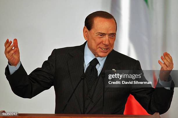 Visiting Italian Prime Minister Silvio Berlusconi gestures during a press conference with his Israeli counterpart and host Benjamin Netanyahu...