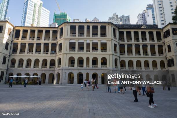 People visit Victoria Prison, a former colonial prison and police station colloquially known as Tai Kwun, or "big station", on its opening day to the...