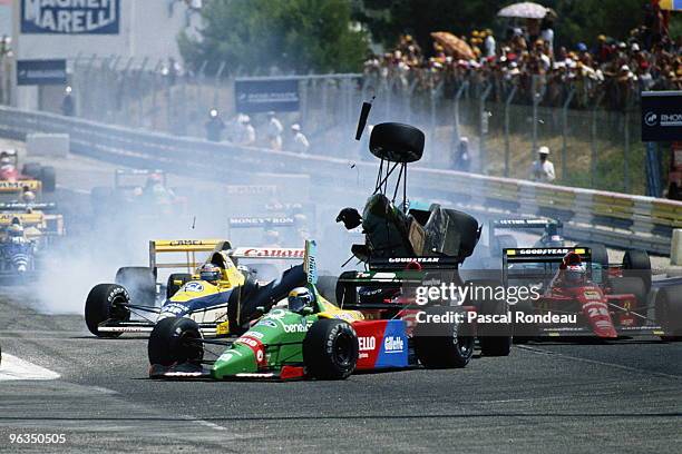 Mauricio Gugelmin driving the Leyton House March Judd CG891 collides with Nigel Mansell at the start of the French Grand Prix on 9th July 1989 at the...