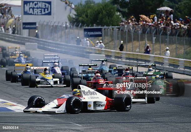 Ayrton Senna driving the McLaren Honda MP4/5 leads the field at the start of the French Grand Prix on 9th July 1989 at the Circuit Paul Ricard in Le...