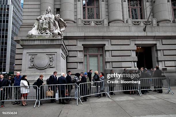 People wait to enter U.S. Bankruptcy Court in New York, U.S., on Tuesday, Feb. 2, 2010. The judge overseeing the liquidation of Bernard Madoff's...