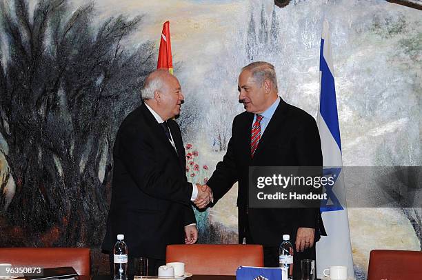 In this handout photo provided by the Israeli Government Press Office , Israeli Prime Minister Benjamin Netanyahu meets Spanish Foreign Minister...