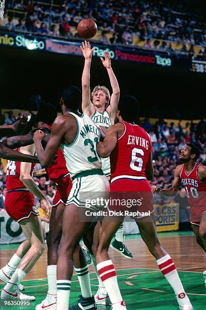 Larry Bird of the Boston Celtics shoots a jump shot against Julius Erving of the Philadelphia 76ers during a game played in 1982 at the Boston Garden...