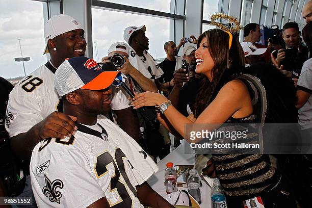 Telemundo TV reporter Mireya Grisales interviews Lynell Hamilton and Sedrick Ellis of the New Orleans Saints during Super Bowl XLIV Media Day at Sun...