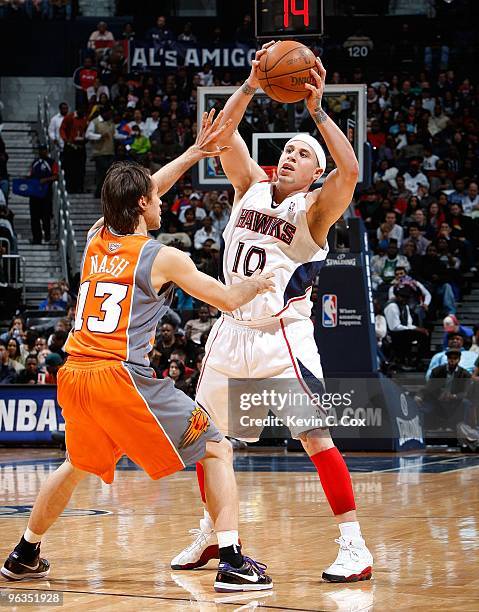 Steve Nash of the Phoenix Suns against Mike Bibby of the Atlanta Hawks at Philips Arena on January 15, 2010 in Atlanta, Georgia. NOTE TO USER: User...